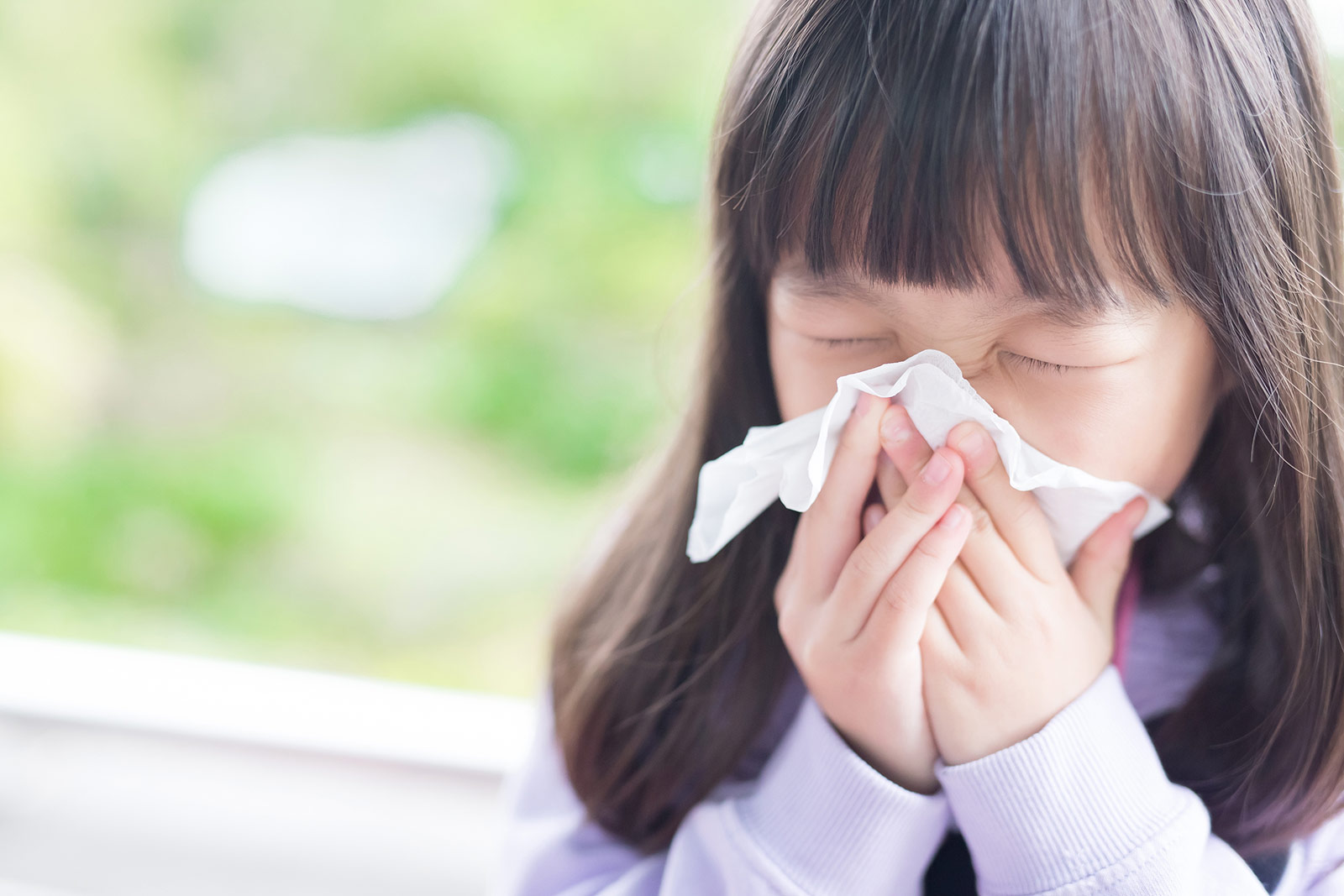 Girl Sneezing