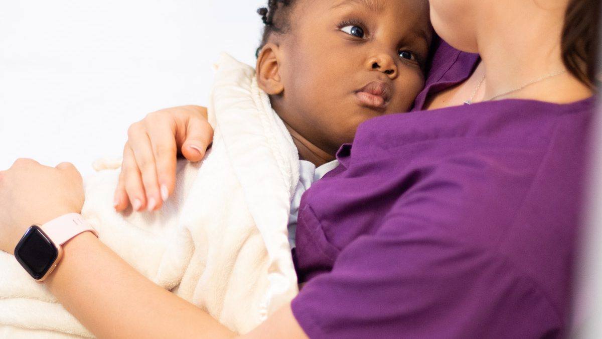 Pediatric Therapist Comforting Child